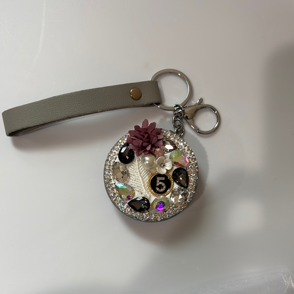 Elegant Gray Keychain with Floral Accent